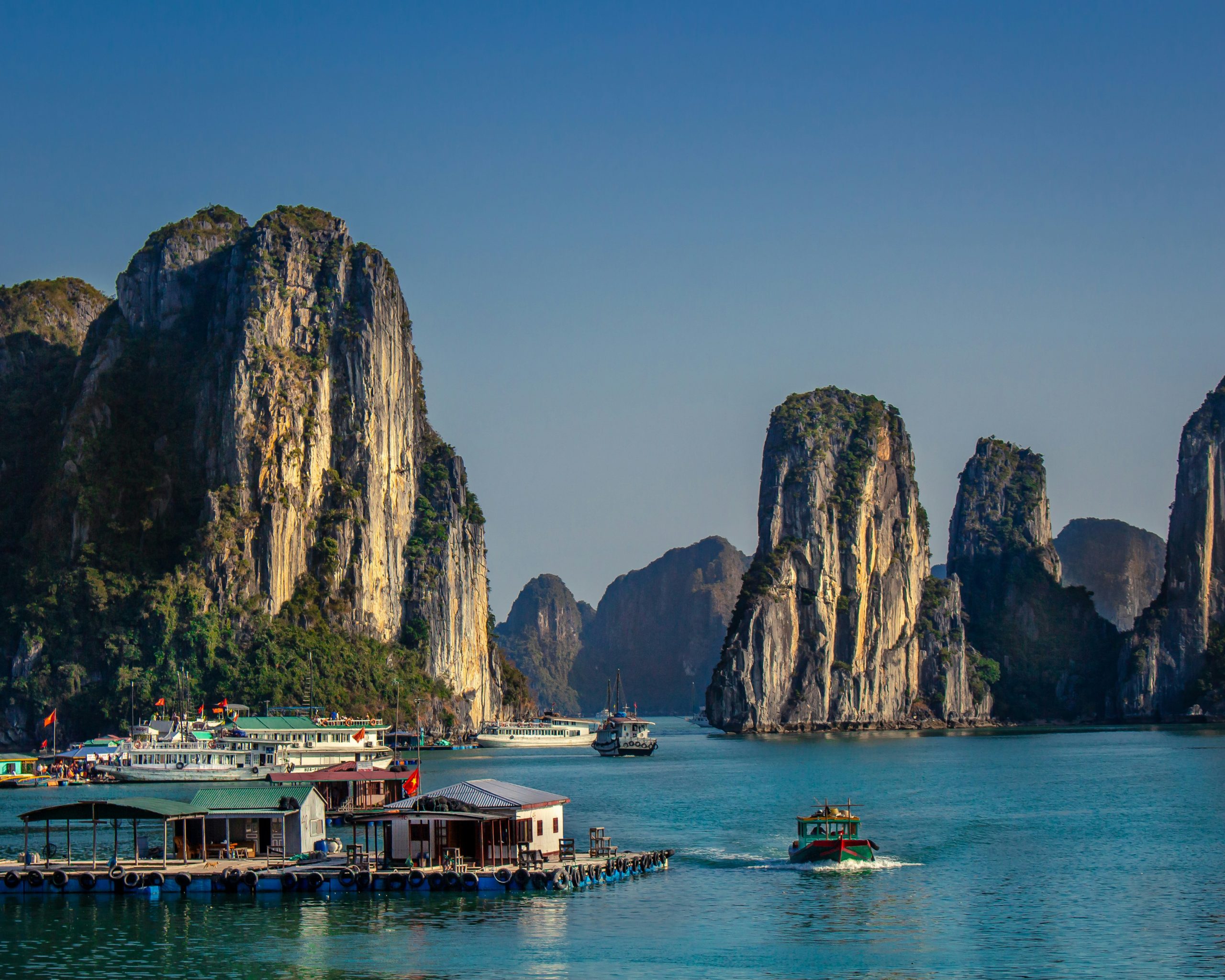 loating fishing village surrounded by limestone islands in Ha Long Bay, Vietnam