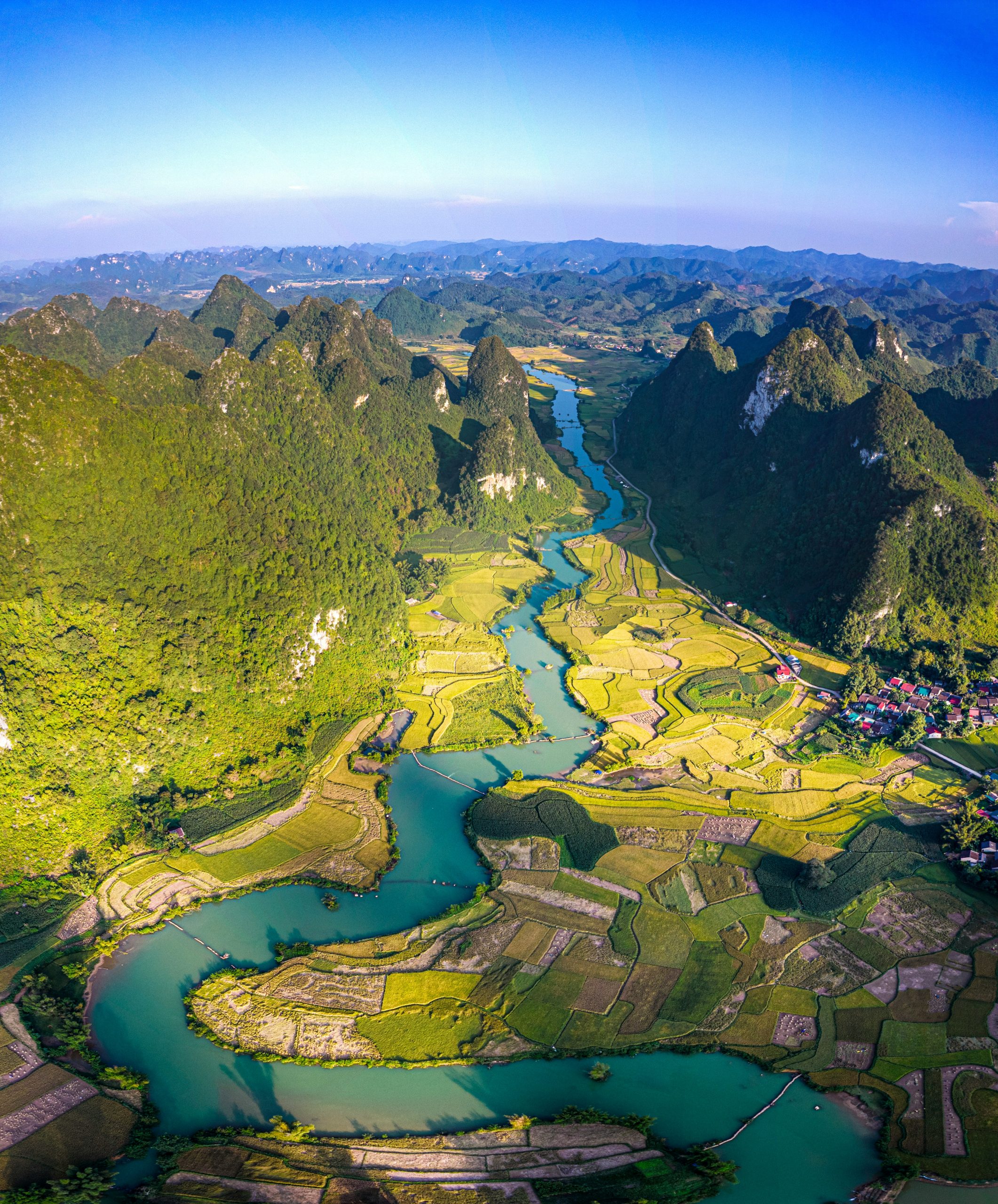 Aerial view of a river winding through a mountain valley in Cao Bang, northern Vietnam