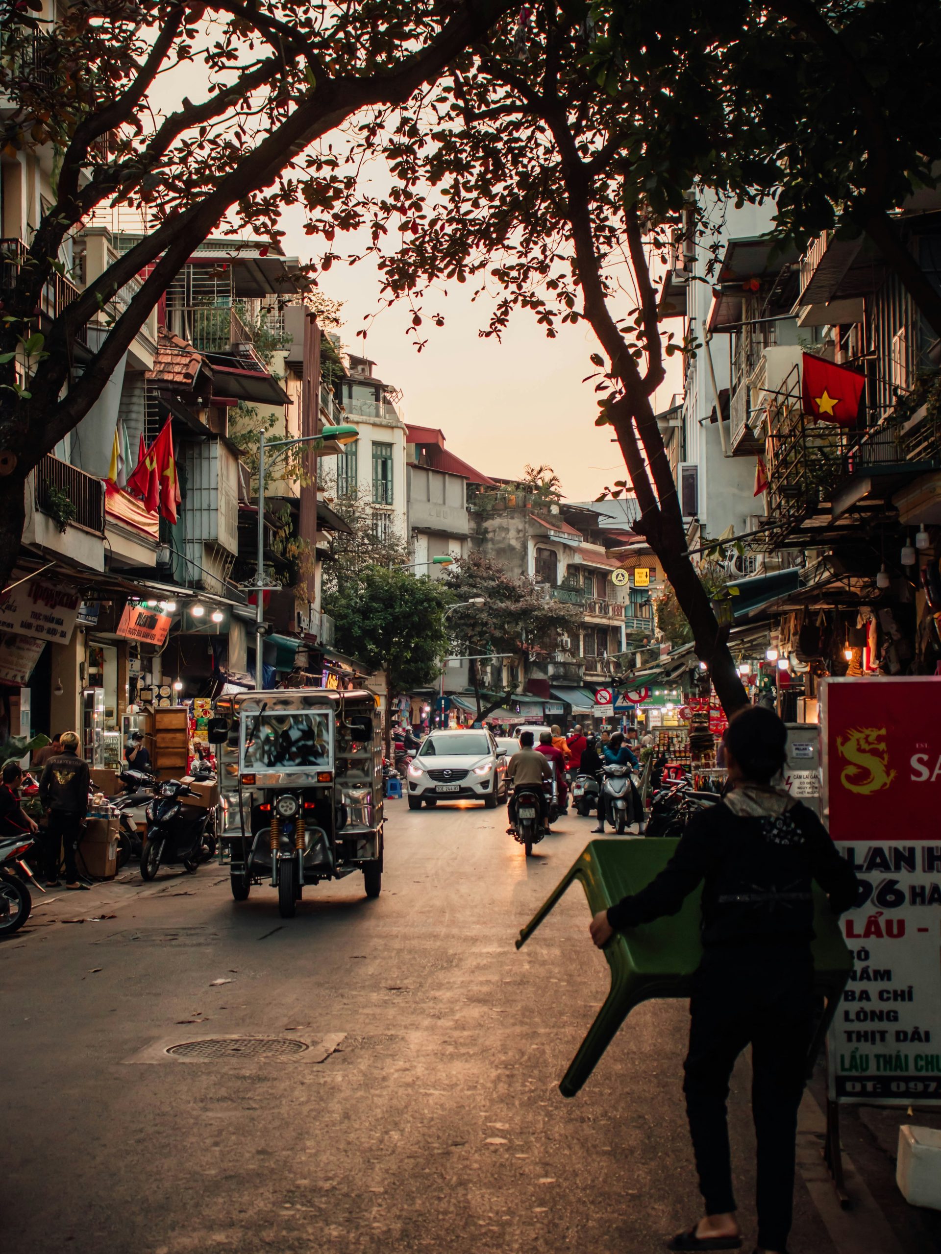 Lively street in Hanoi Old Quarter with traditional houses and local life