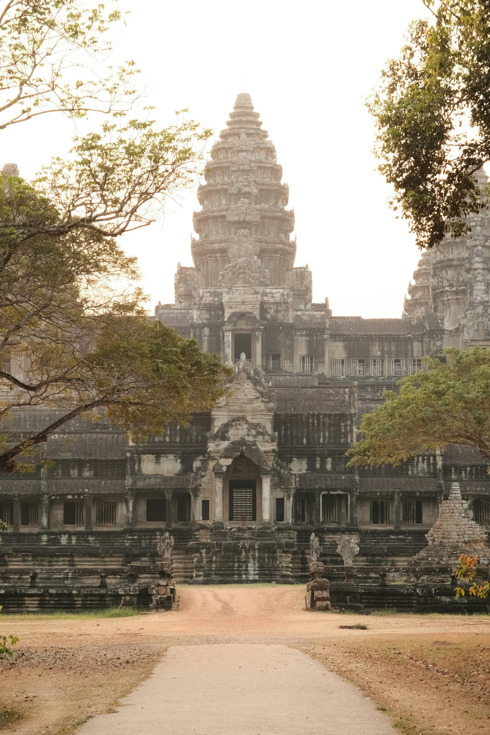 Ancient Angkor temple surrounded by lush forest in Cambodia