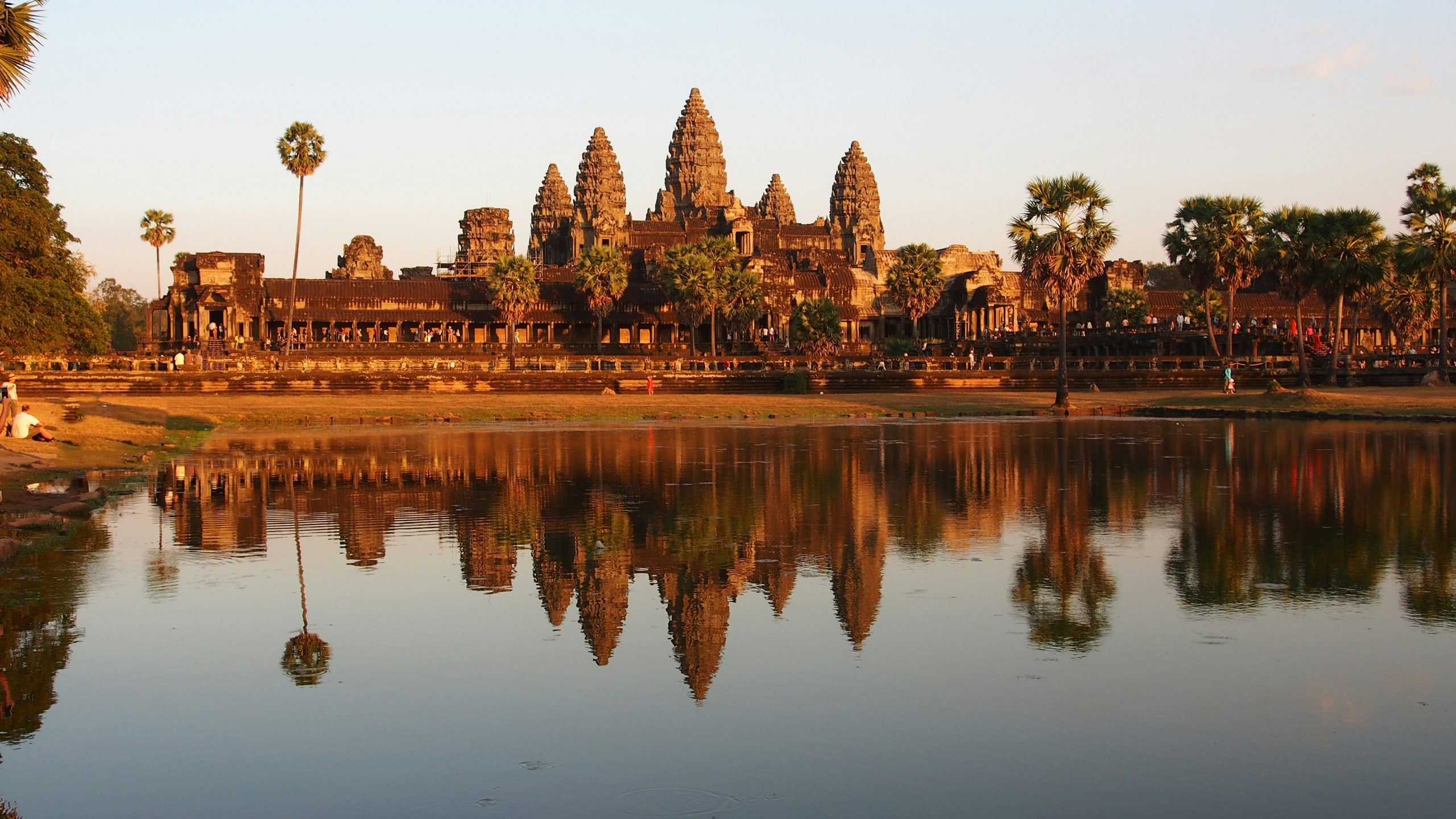 Angkor Wat temple reflected in the water at sunset in Cambodia