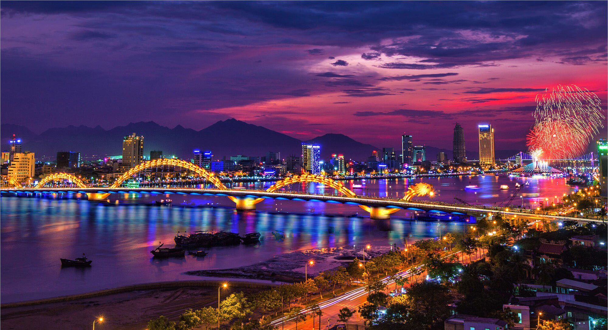 Dragon Bridge spanning the Han River at night in Da Nang, Vietnam