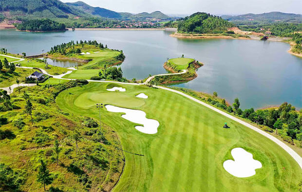 Thanh Lanh Valley Golf Course surrounded by mountains and lake in northern Vietnam
