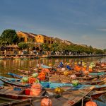Hoi An Ancient Town and river with a traditional boat in Vietnam