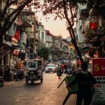 Lively street in Hanoi Old Quarter with traditional houses and local life