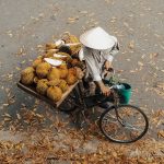 Local selling durian on his bike, Vietnam
